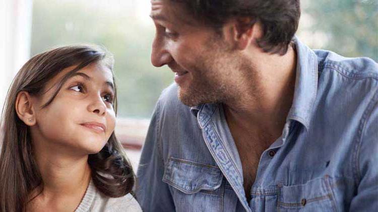 Dad talking to young daughter about emergency preparedness.